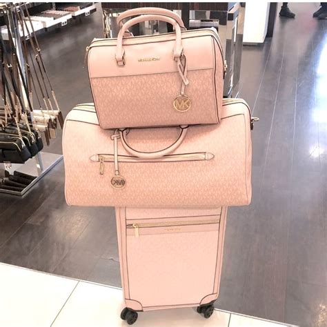 carry michael kors|Michael Kors pink suitcase.